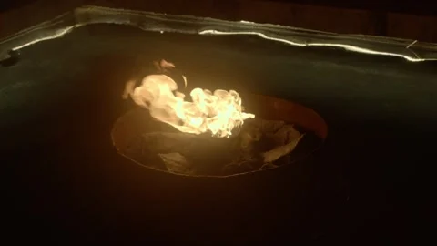 Slow motion fire flame on water. Fire pit on water pool Stock Footage 304469985
