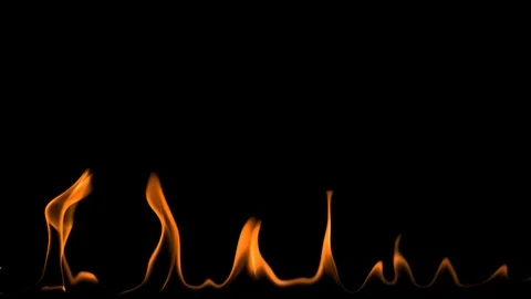 Slow motion fire flames burning gently on an isolated black background Video stock 122158606
