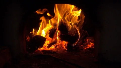 Slow motion fire flames in fireplace. Bonfire and coals close-up Stock Footage 87070658