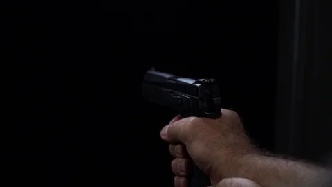 Slow motion of a fire from gun. Pirates shoot in somebody. Man hand hold gun and Stock Footage 116502877
