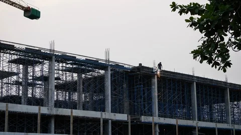 Slow motion fire sparkling, worker welding steel structure of construction site Stock Footage 91222346