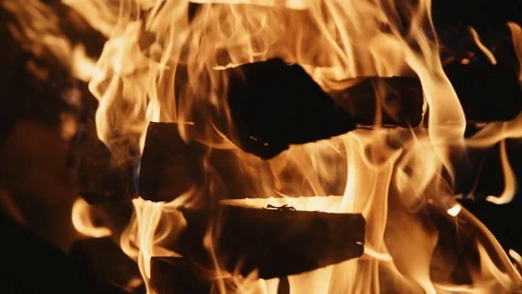 Slow motion fireplace burning bright orange home energy wood warm detail Video stock 100156090