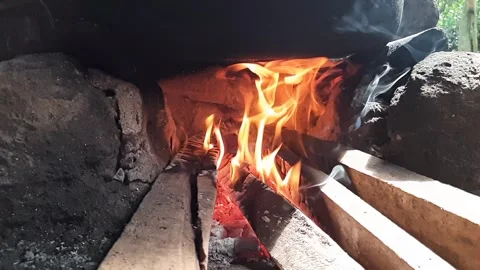 Slow Motion Firewood Burning with Flames and Hot Charcoal in Rustic Fireplace Stock Footage 331429923