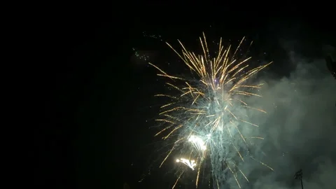 Slow motion fireworks exploding over baseball stadium Stock Footage 300709681