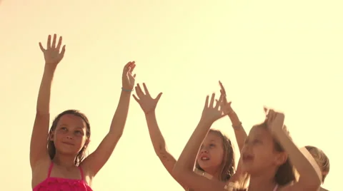 Slow motion of five children playing with beach ball on beach. Stock Footage 43673033