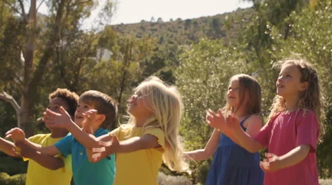 Slow motion of five children playing with beach ball in park. Stock Footage 43673113