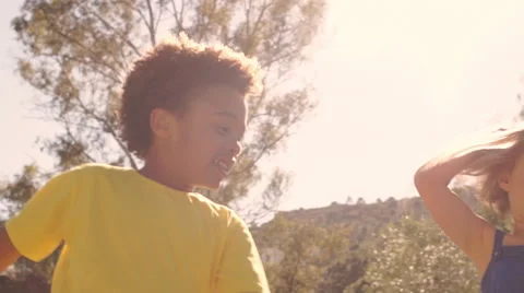 Slow motion of five children spinning around in park. Stock Footage 43673543