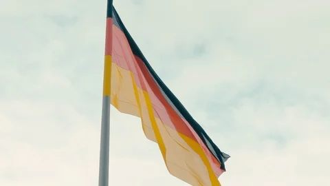 Slow Motion Flag of Germany against the blue turquoise sky Stock-Footage 105250890
