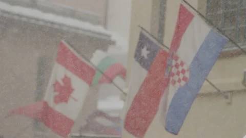 Slow motion of flags in breeze at Beaver Creek Ski resort in winter in Colorado Stock Footage 204795536