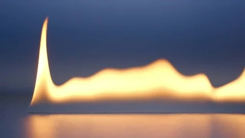 SLOW MOTION: Flame on blue background Stock Footage 73412388