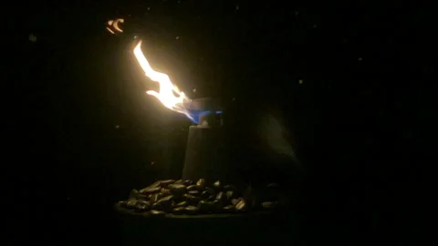 Slow Motion: Flame in the Snowing Dark Night on Fountain Water Stock Footage 145196667