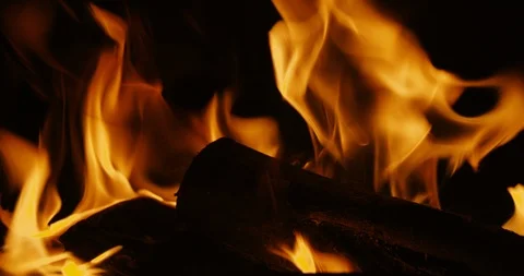 Slow motion flames with burning logs in 4K Stock-Footage 118994772