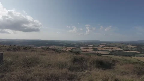 Slow motion flat profile stone monument pillar on hill peak Stock Footage 340449467