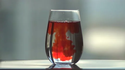 Slow Motion Flavour Shot into Clear Glass Cup. Stock Footage 57283429
