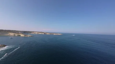 Slow-motion flight of a fpv drone into the open sea Stock Footage 248650894