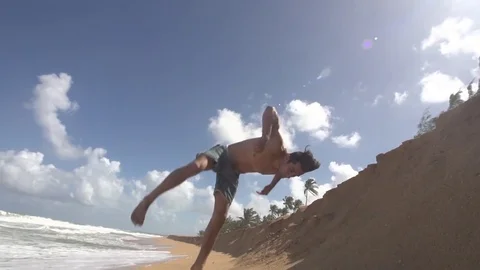Slow Motion Flip Off Sand Dune at the Beach Stock Footage 79276545