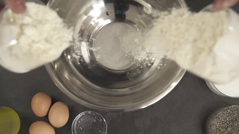 Slow motion Flour added to a Mixing Bowl Stock Footage 85876243