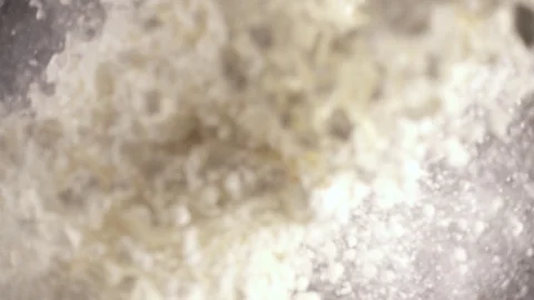 Slow motion flour falls down from under the camera Stock Footage 90959118
