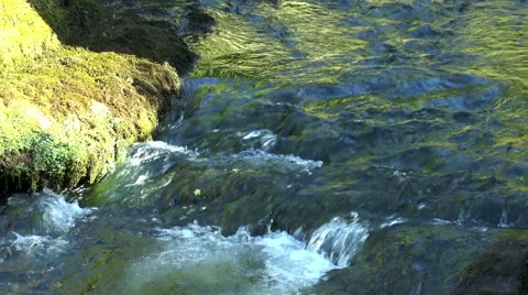 Slow motion. Flow and waterfall of narrow river. Stock Footage 53411265