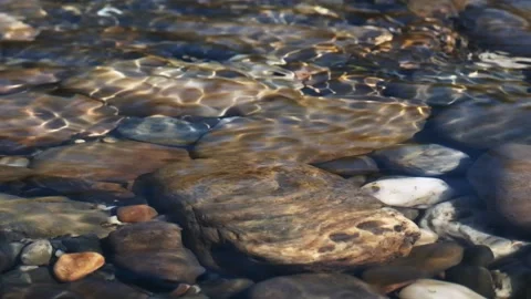 Slow motion flow of water of a mountain river with stones under water.  Flow  Stock Footage 204156759