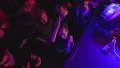 Slow motion fly through night club top view people dancing to music at party HD Footage