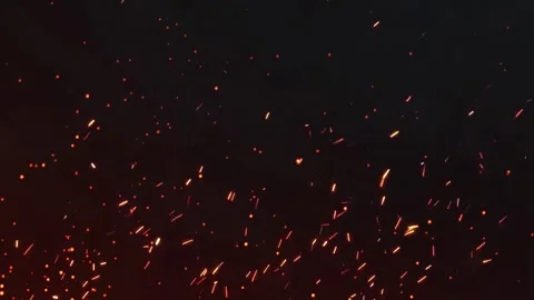 Slow Motion of Flying Fire Sparkles. Bokeh lights on black background, shot Stock Footage 281401013