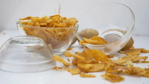 Slow motion of flying potato chips Stock Footage 139812481