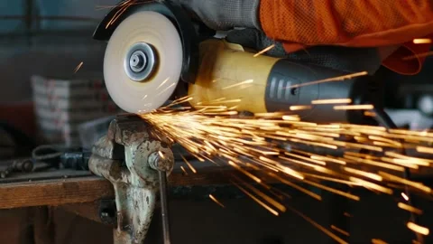 Slow motion of flying sparks from cutting metal with a grinder. Stock Footage 228220451