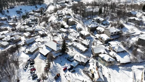 Slow motion flyover shot above Greek settlement, village of Nymfaio in calm Video stock 301605038