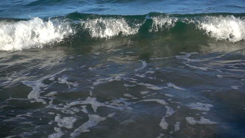 Slow motion foam waves roll Stock Footage 102267337