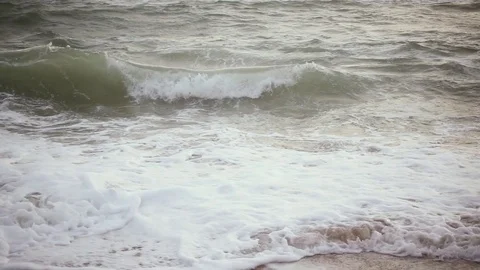Slow Motion Foam Waves on sand beach close-up Stock Footage 82971035