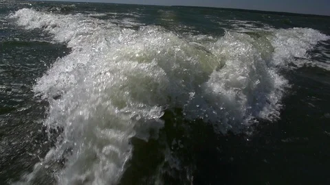 Slow motion of  a Foaming Water Behind MotorBoat. Stock Footage 105303916