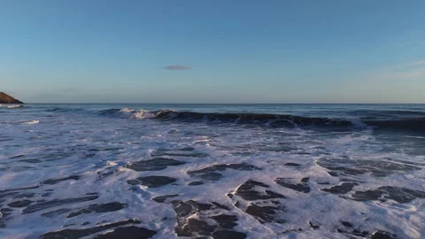 Slow Motion Foamy Ocean Surface Near Coastline in 4K Stock-Footage 332944267