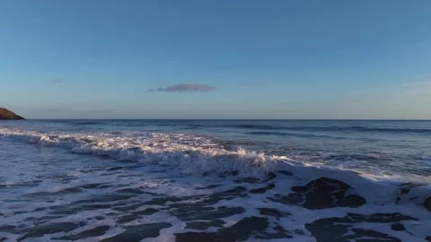 Slow Motion Foamy Ocean Surface Near Coastline in 4K Video stock 332944470