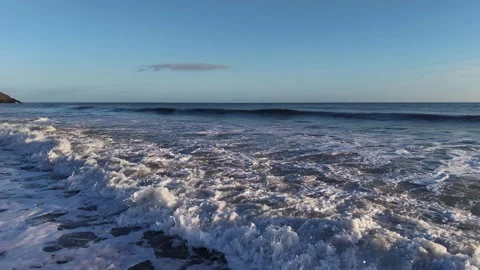 Slow Motion Foamy Ocean Surface Near Coastline in 4K Video stock 332944509