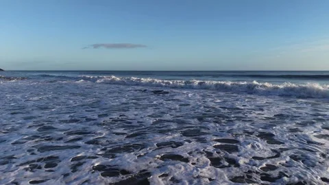 Slow Motion Foamy Ocean Surface Near Coastline in 4K Stock Footage 332944511