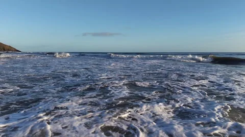 Slow Motion Foamy Ocean Surface Near Coastline in 4K Video stock 332944521