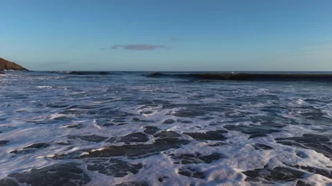 Slow Motion Foamy Ocean Surface Near Coastline in 4K 库存影片 332944536