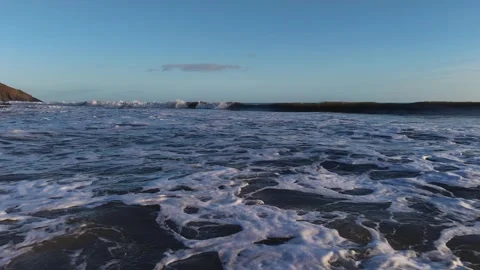 Slow Motion Foamy Ocean Surface Near Coastline in 4K Vídeo Stock 332944537