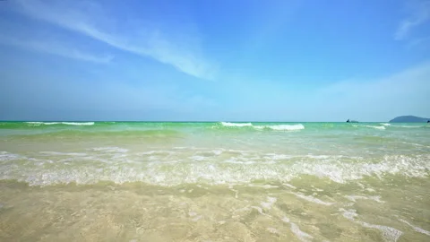 Slow Motion of Foamy Waves Rolling Towards Sand Beach. Crashing Waves Hitting a Stock Footage 259281231