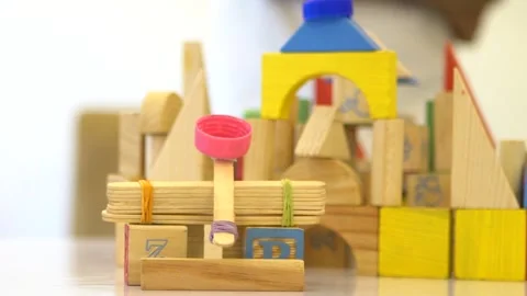 Slow Motion Focus and Pan Of A Wooden Block City Stock Footage 300730018
