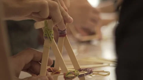 Slow Motion Focus Hands Put Rubber Bands Popsicle Stick Catapult Stock Footage 300729825