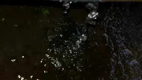 Slow Motion Focus on Raindrops Falling on the Ground Stock Footage 156293069