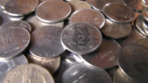 Slow Motion Focusing of Coins Stock Footage