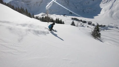 Slow Motion Follow Cam Backcountry Powder Skiing in the Austrian Alps 4K 60fps Stock Footage