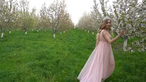 Slow motion following back five years age brunette girl with blue dress running Stock Footage 128434858