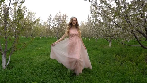 Slow motion following back five years age brunette girl with blue dress running Stock Footage 128434863