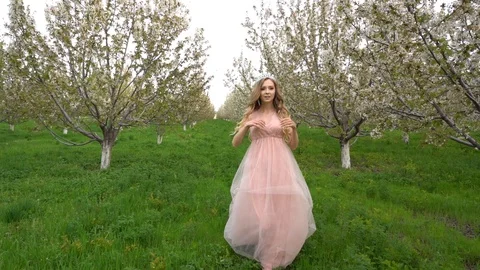 Slow motion following back five years age brunette girl with blue dress running Stock Footage 128434946