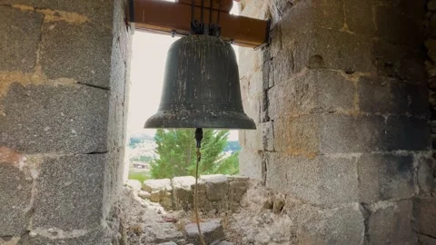 Slow motion footage of a bell inside the bell tower Stock Footage 293238617