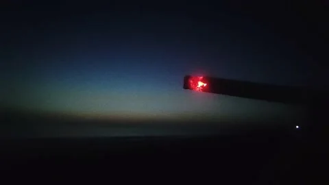 Slow motion footage of a burning joint of a man smoking a cigarette at night. Stock Footage 202841739